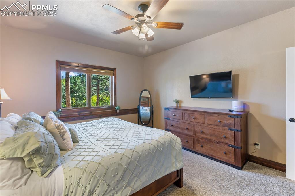 Image 30 of 38: The bedroom in the apartment is roomy and bright.