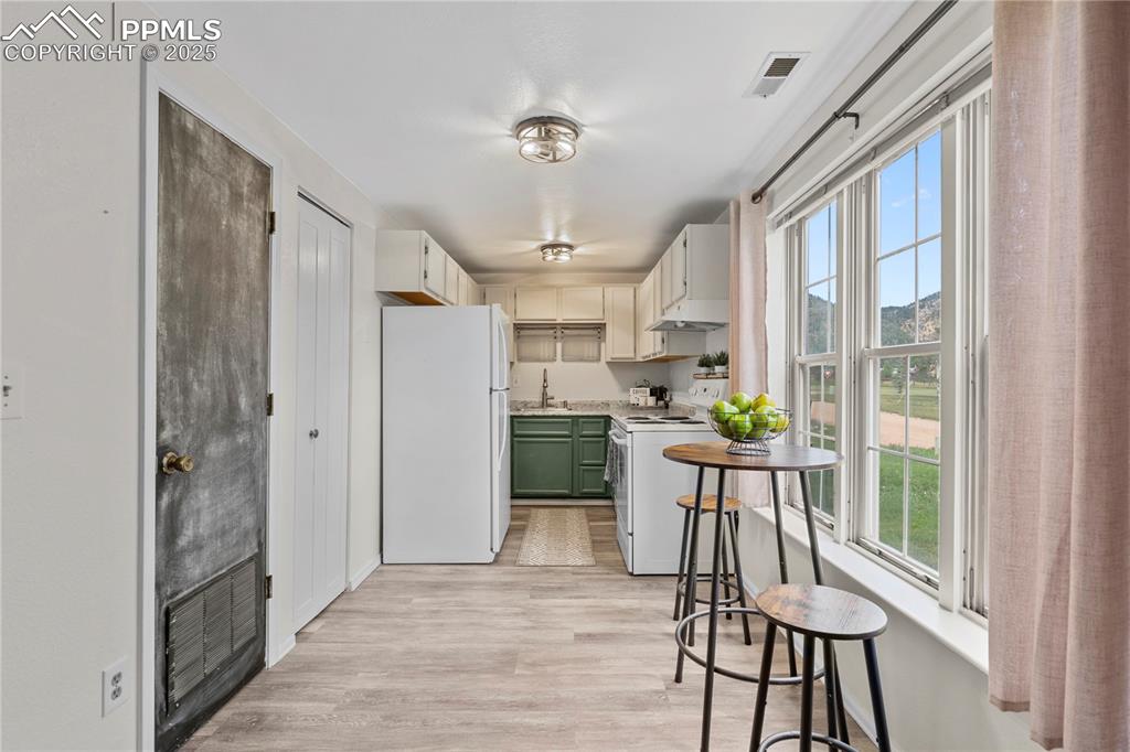 Image 3 of 37: Micro-kitchen...small space, fully-equipped!