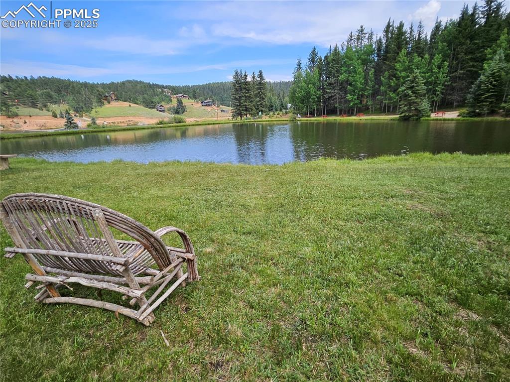 Image 42 of 47: Bench Overlooking Community Pond.