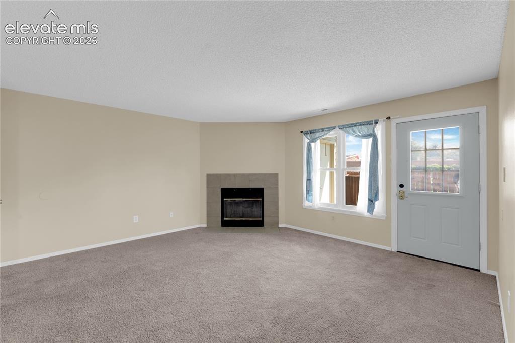 Image 11 of 22: Wood burning fireplace