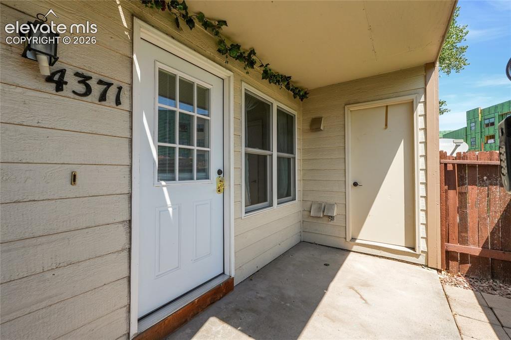 Image 19 of 22: Front Patio and Door