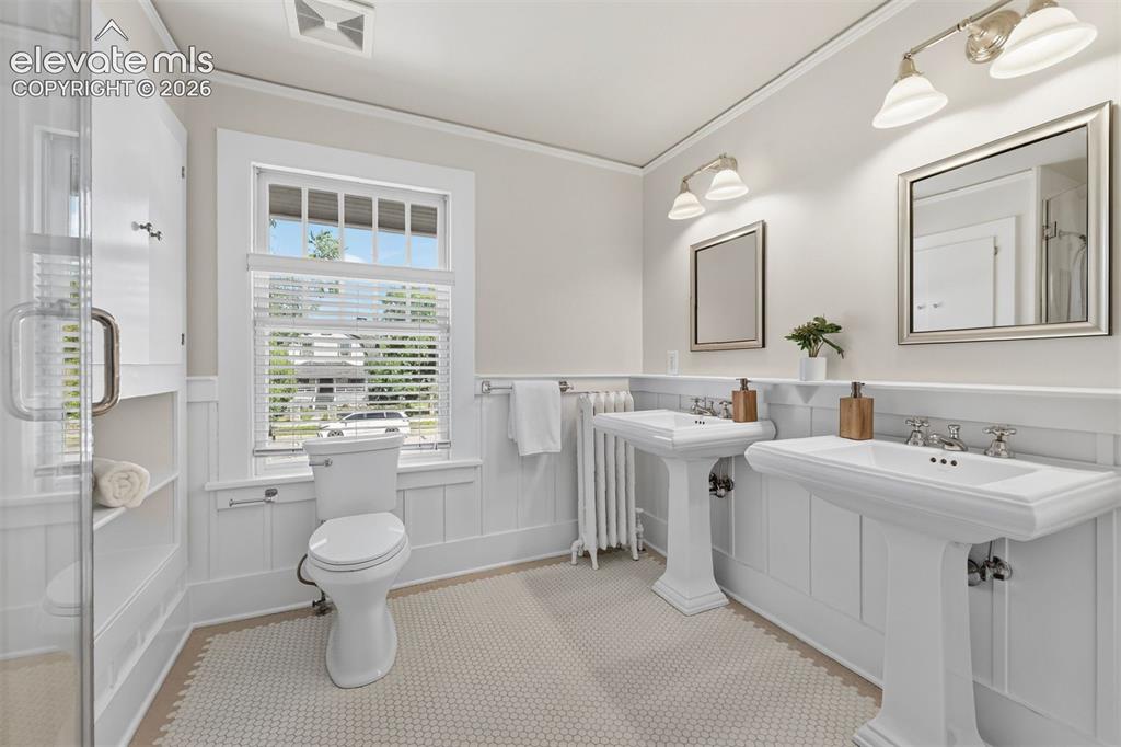 Image 7 of 36: Primary ensuite bathroom with walk in shower.