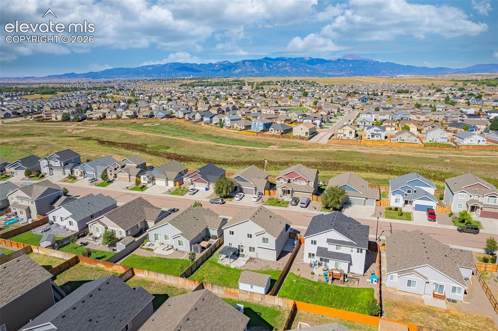 Image 38 of 45: Expansive residential area featuring numerous detached homes with varied ar