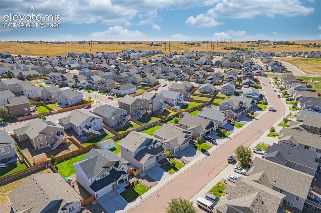 Image 41 of 45: Residential neighborhood with uniform housing styles and street infrastruct