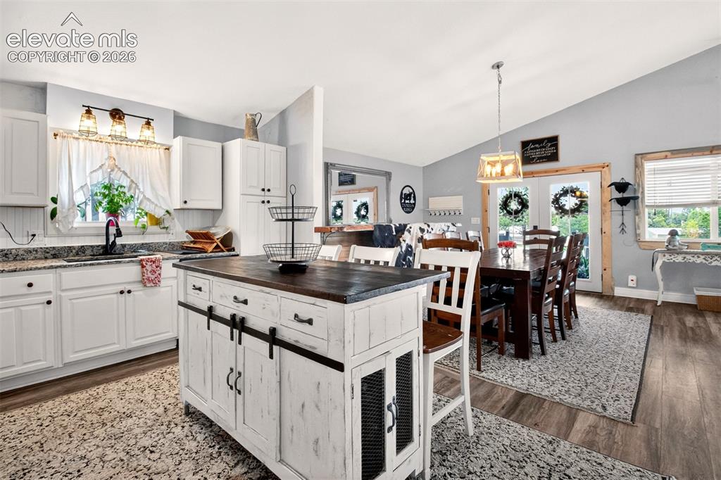 Image 11 of 50: Nice open-concept layout flowing seamlessly from the kitchen into the dinin