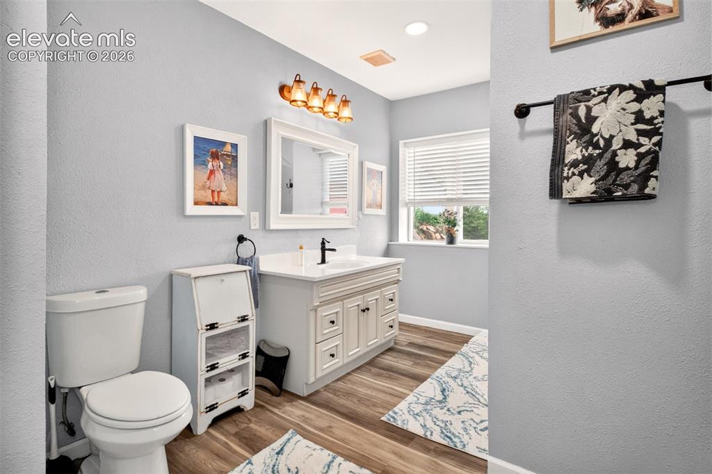 Image 32 of 50: Generously oversized full bathroom serving the finished basement