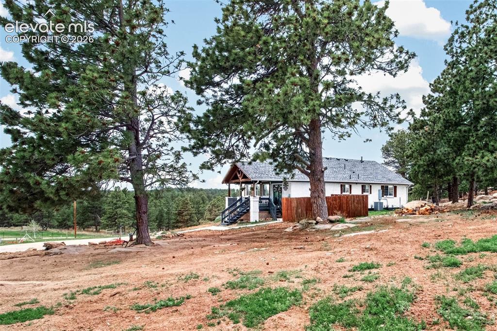 Image 4 of 50: Nestled on a Desirable Wooded Homesite!