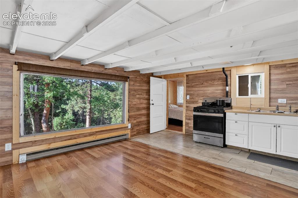 Image 9 of 39: Newer flooring in the living room