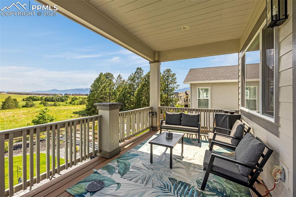 Image 27 of 35: Large covered deck + amazing view!