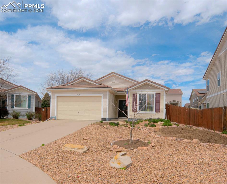 Image 1 of 17: Single-story residence featuring light-colored siding, a front entry, and a