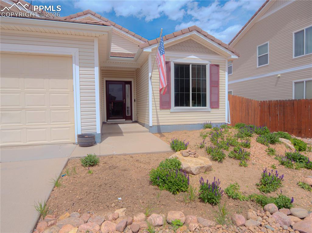 Image 3 of 17: Exterior with light-colored siding and a tile roof