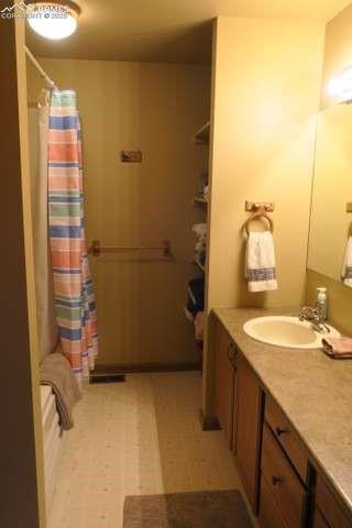 Image 14 of 36: Full bath (in primary BR suite) with shower and vanity