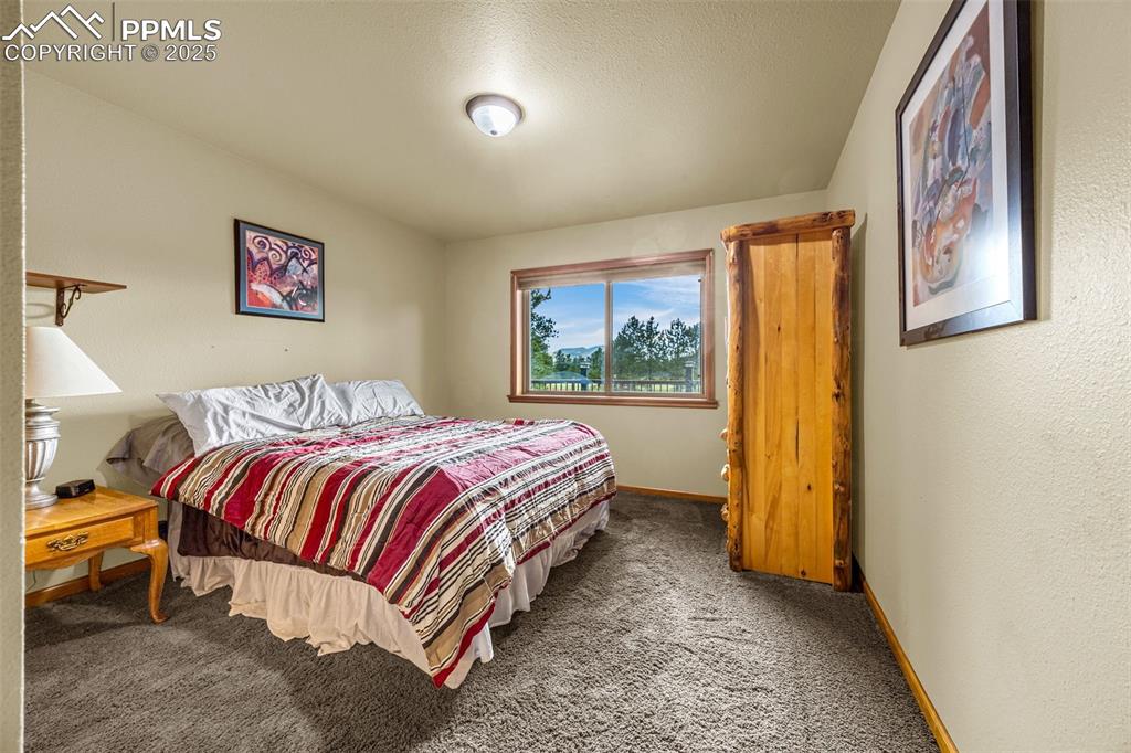Image 17 of 36: Bedroom 2 with carpet floors and baseboards