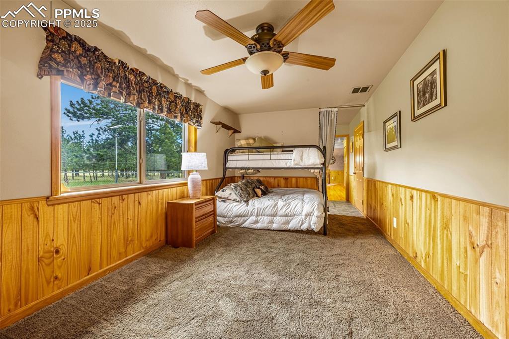 Image 20 of 36: Bonus room - currently set up as a NC bedroom.