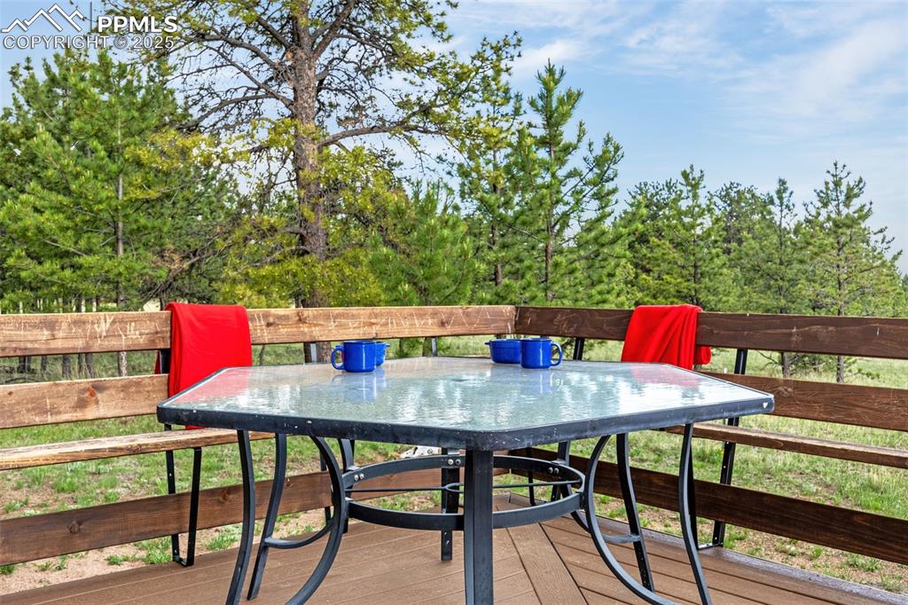 Image 31 of 36: Deck with outdoor dining/seating area