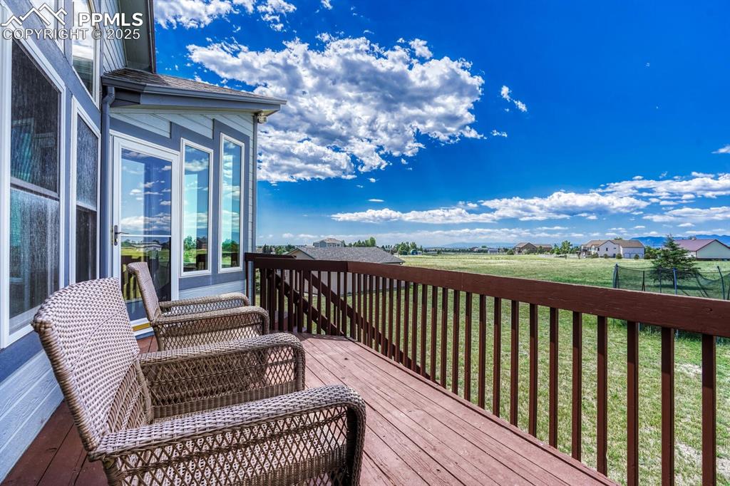 Image 19 of 50: Step out to the backyard deck & enjoy golden Colorado sunsets & fabulous Pe