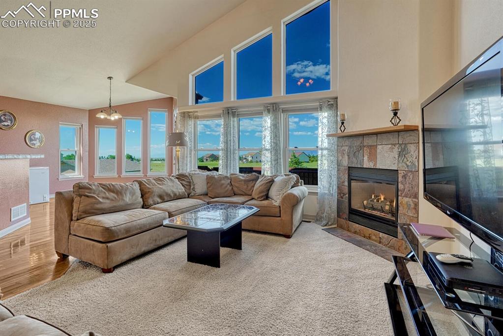 Image 23 of 50: Beautiful views from the wall of windows in the Family Room and Dining Nook