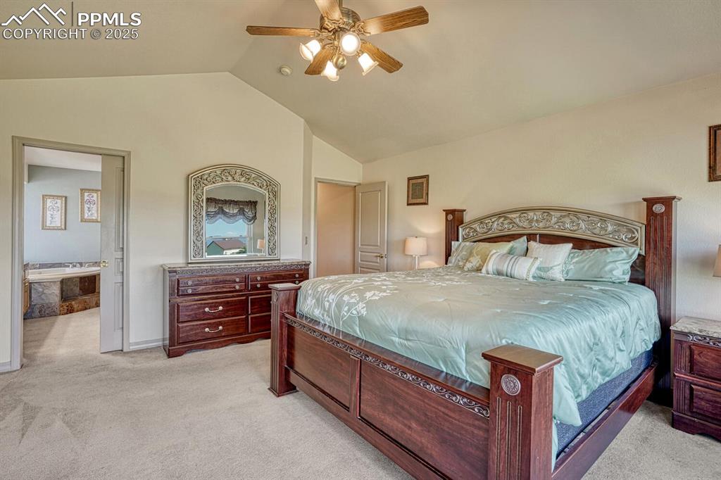 Image 26 of 50: Primary Bedroom into the adjoining Primary Bathroom.