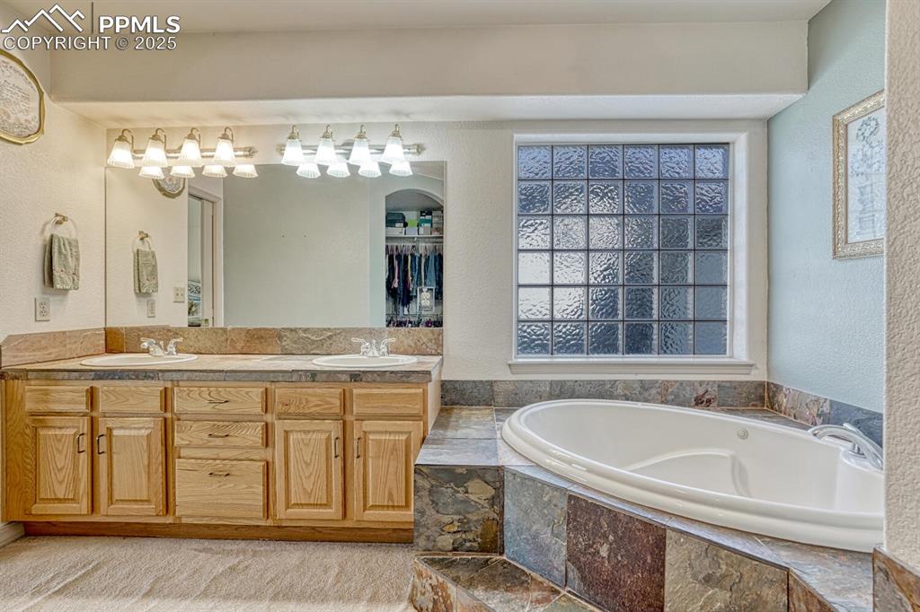 Image 28 of 50: Main Level Primary Bathroom