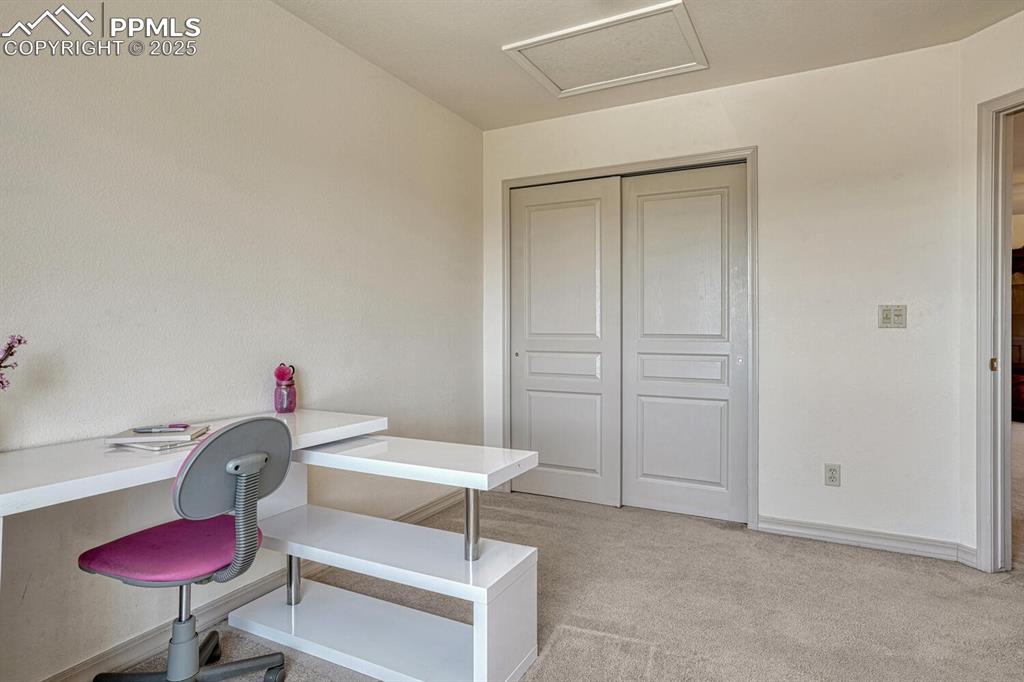 Image 32 of 50: Upper Level Bedroom #2 (currently used as an office).