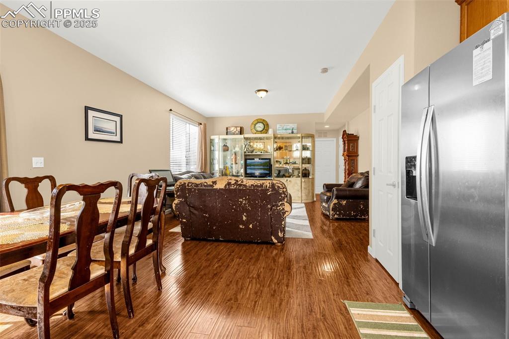 Image 7 of 23: Dining room with wood finished floors
