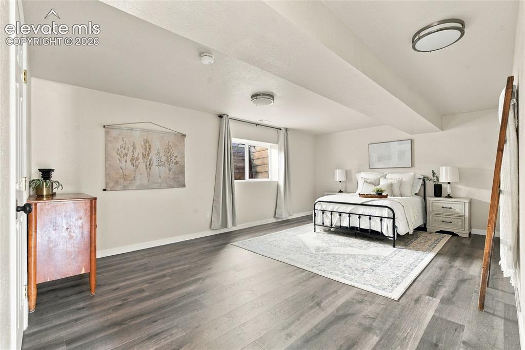 Image 25 of 37: Basement room featuring wood-finish flooring, recessed lighting, and a wind