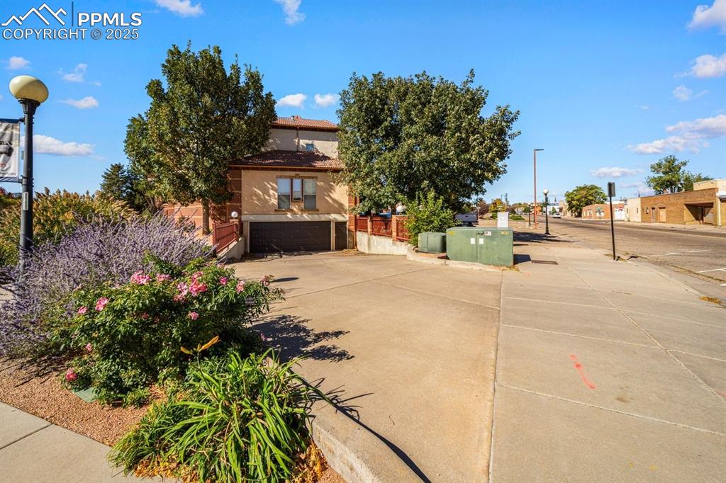 Image 32 of 41: View of front of house with stucco siding