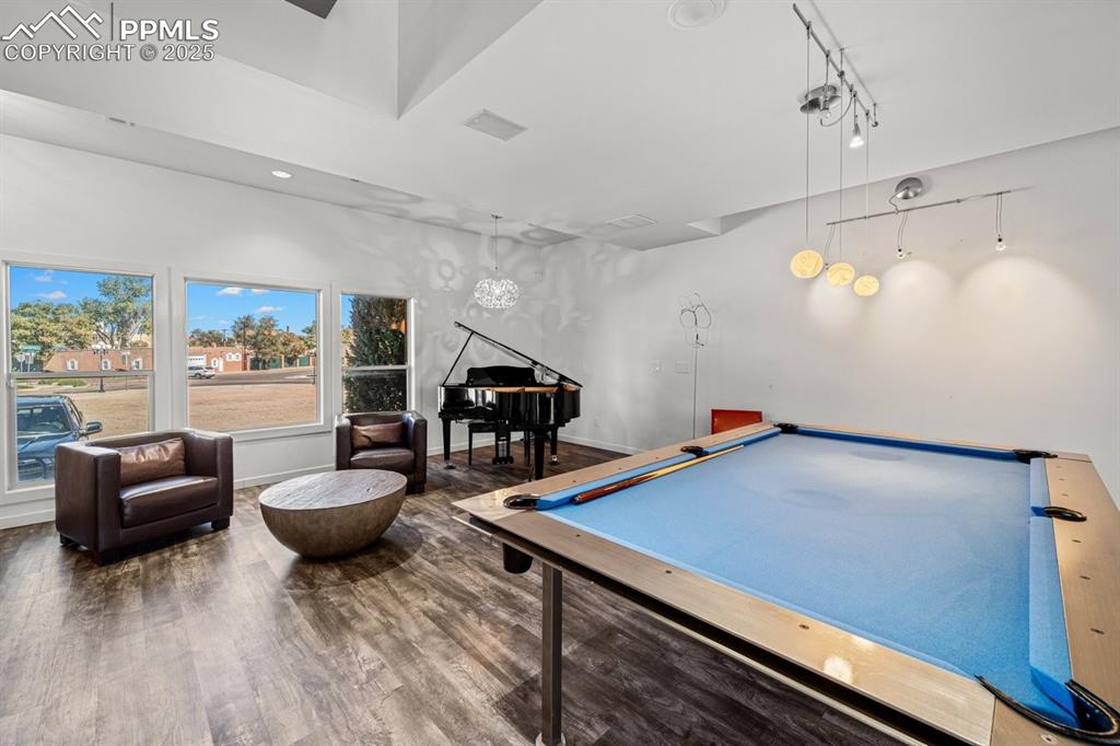 Image 4 of 41: Game room with billiards table, dark wood-style floors, and recessed lighti