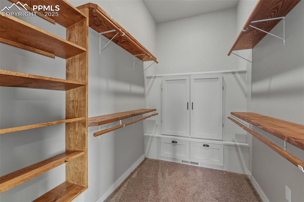 Image 19 of 50: Primary Bedroom Walk in Closet.