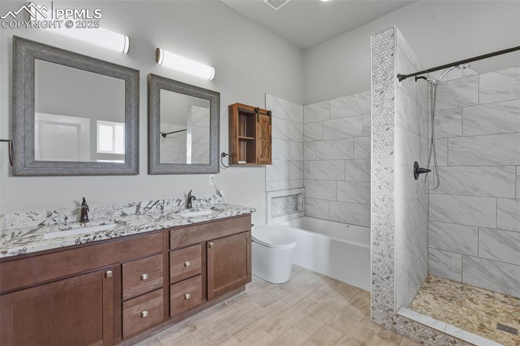 Image 20 of 50: Luxury smart toilet featuring an automatic lid that opens as you approach, 