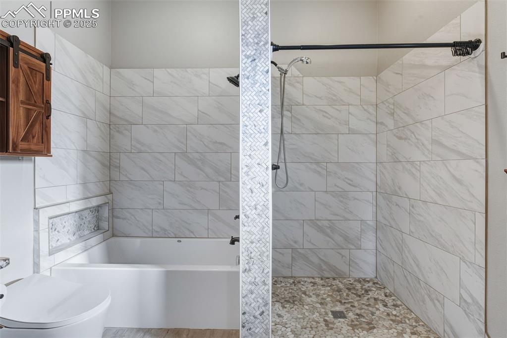 Image 21 of 50: Primary Bathroom 5 Piece.