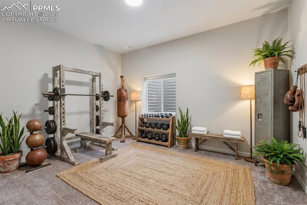 Image 33 of 50: Virtually Staged as a Gym.