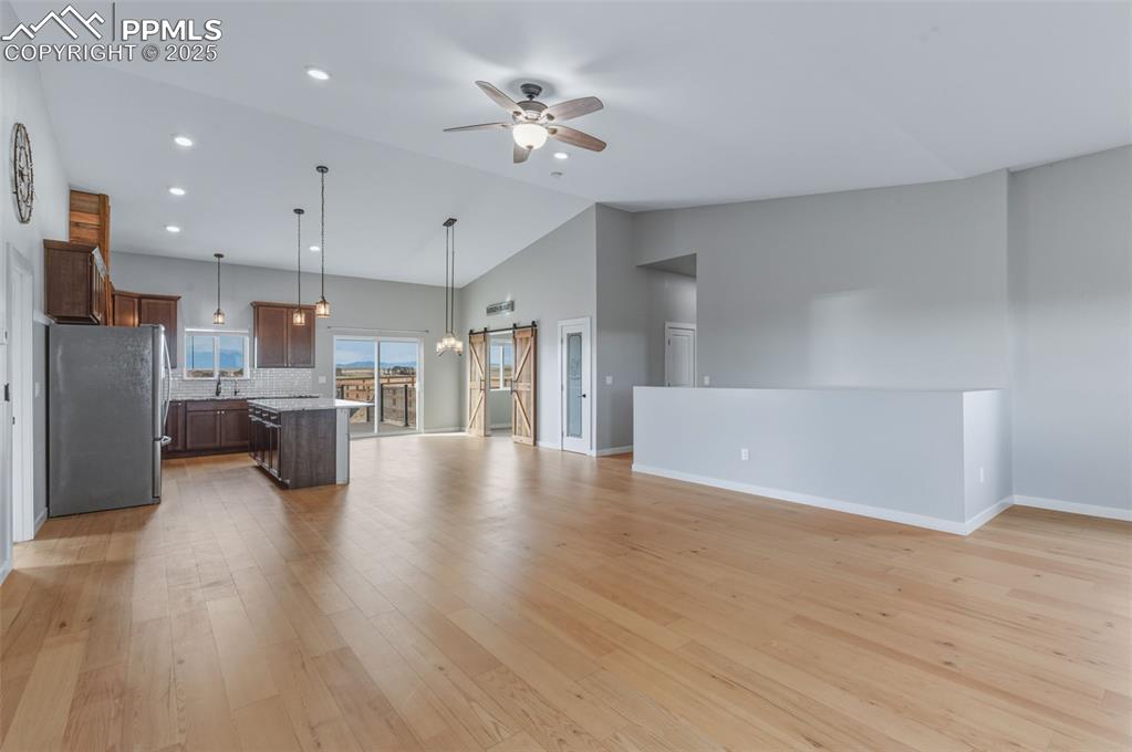 Image 6 of 50: Check out these 13 ft ceilings and the amazing open concept floor plan.