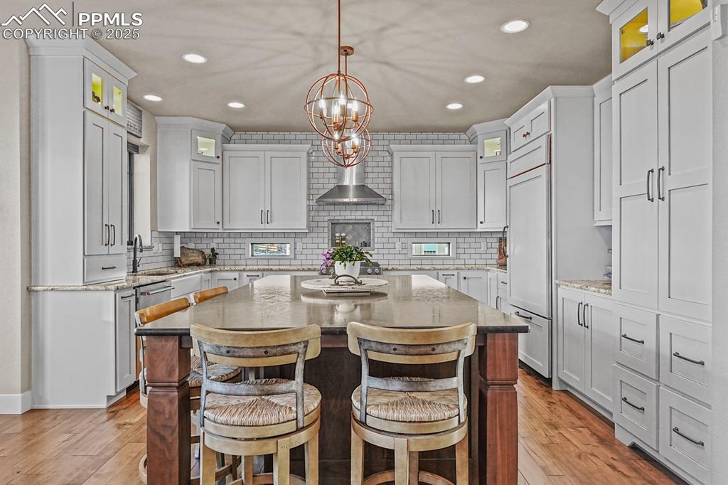 Image 14 of 46: Kitchen featuring modern upgrades 