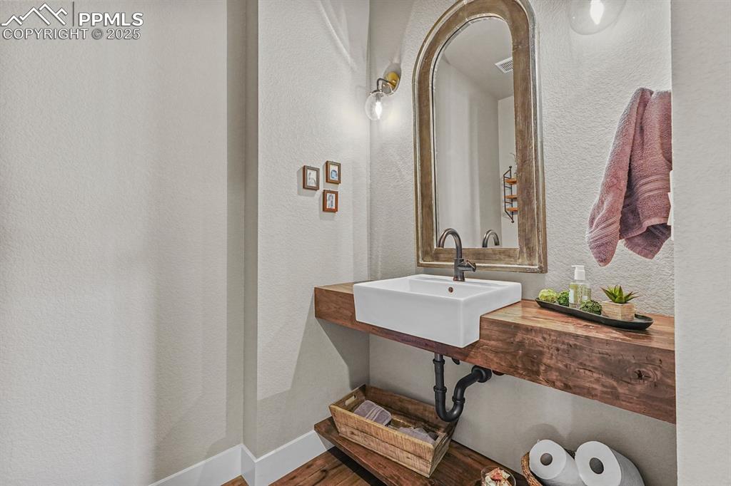 Image 22 of 46: Half hall bathroom-main level