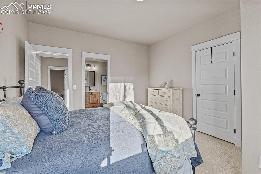 Image 28 of 46: Bedroom 1 with connected bathroom