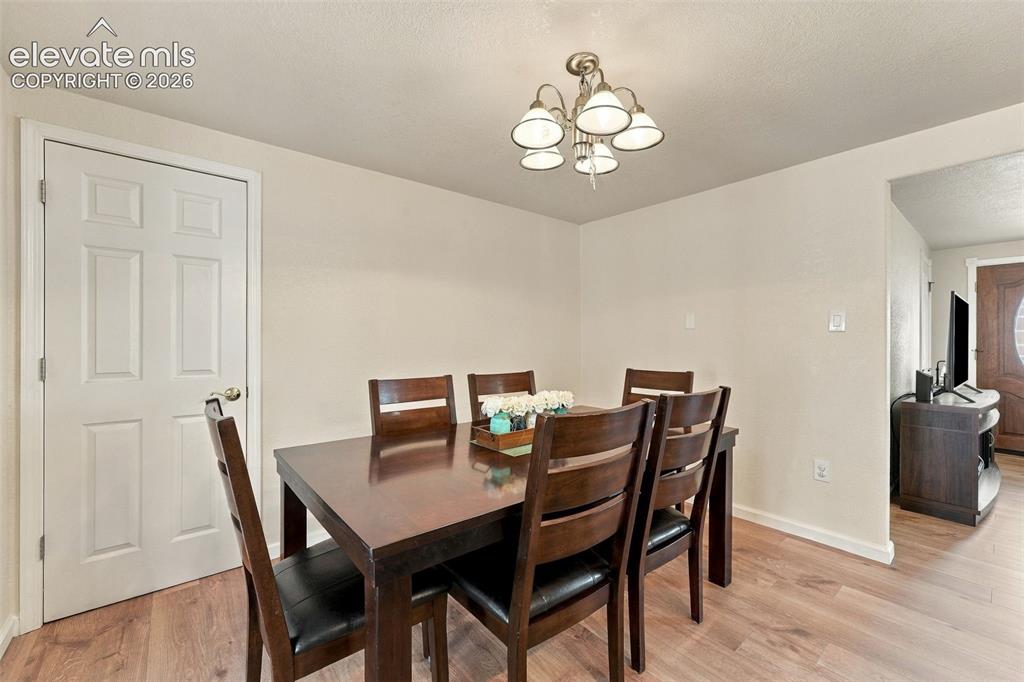 Image 18 of 48: Wood-finish flooring throughout