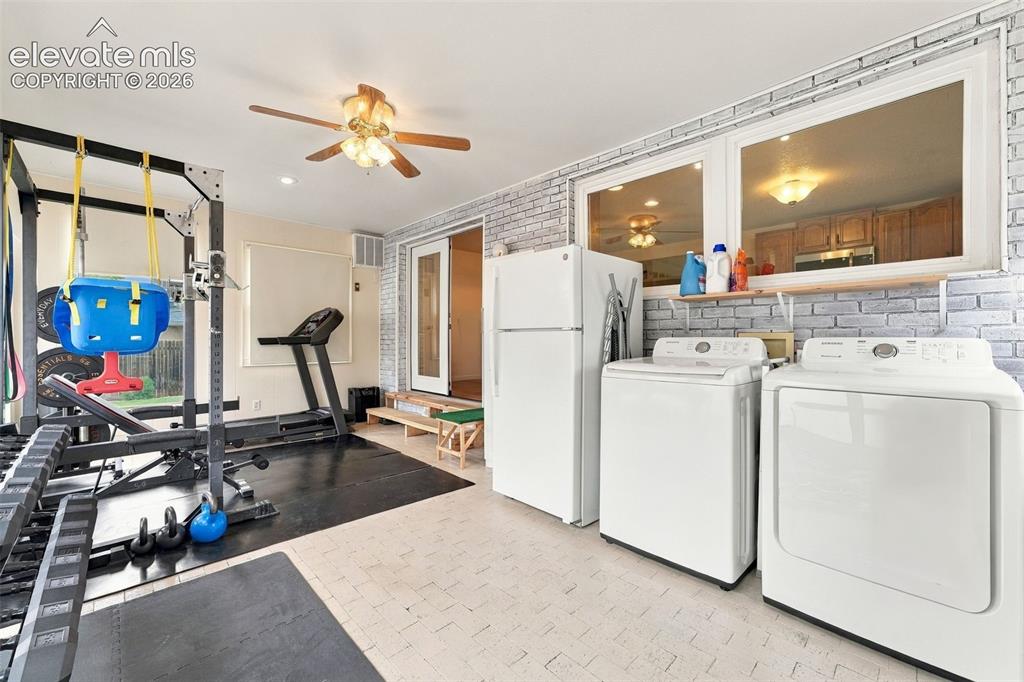 Image 26 of 48: Recessed lighting, ceiling fan, white paneled double doors, and two horizon