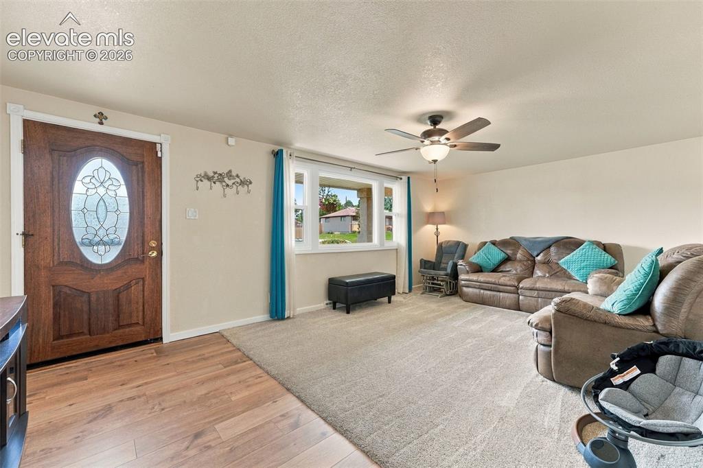 Image 7 of 48: Entryway featuring a wood door with leaded glass, wood-finish flooring, and