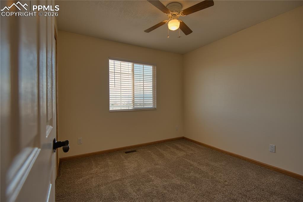 Image 16 of 27: Bedroom 1 across the hall from the guest bathroom