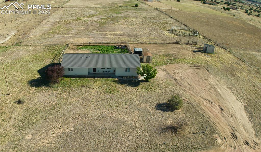 Image 24 of 27: Full view of property from drone