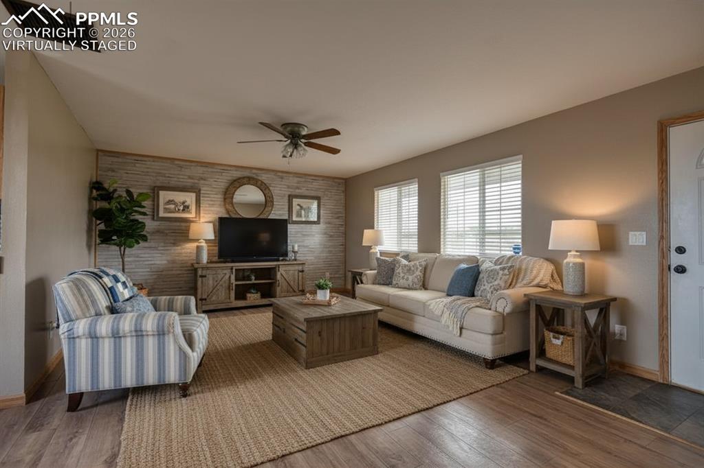 Image 9 of 27: Virtually staged living room with cozy country style furnishings.