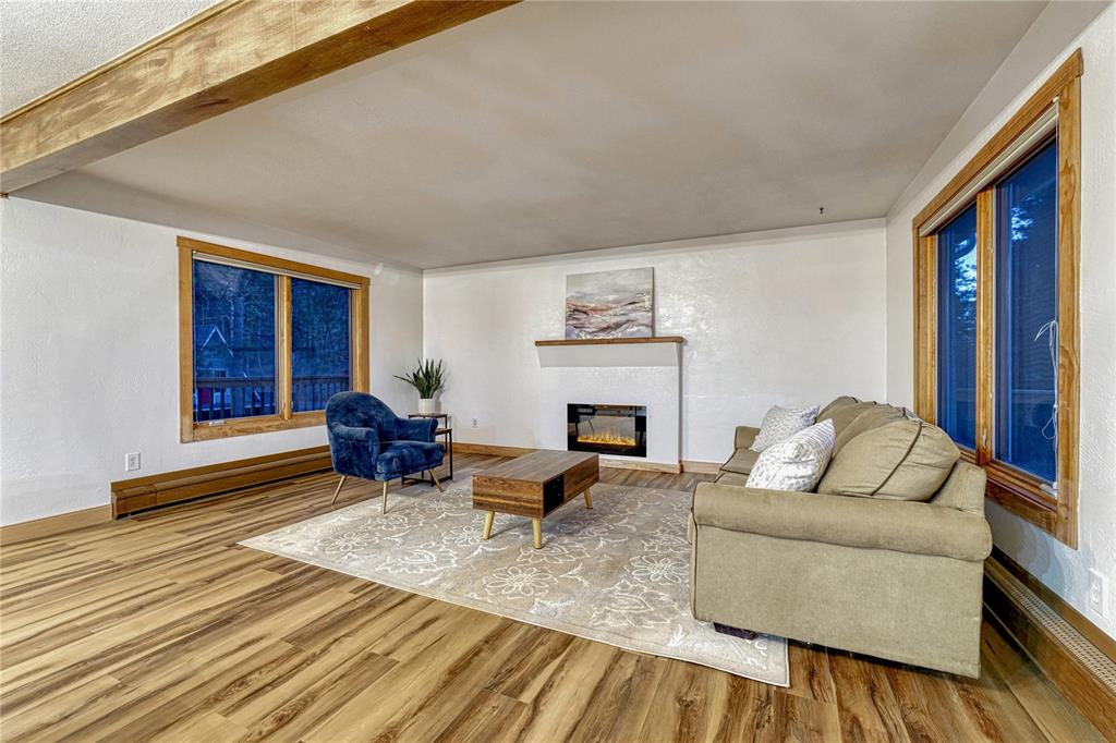 Image 11 of 49: Cozy family room with electric fireplace