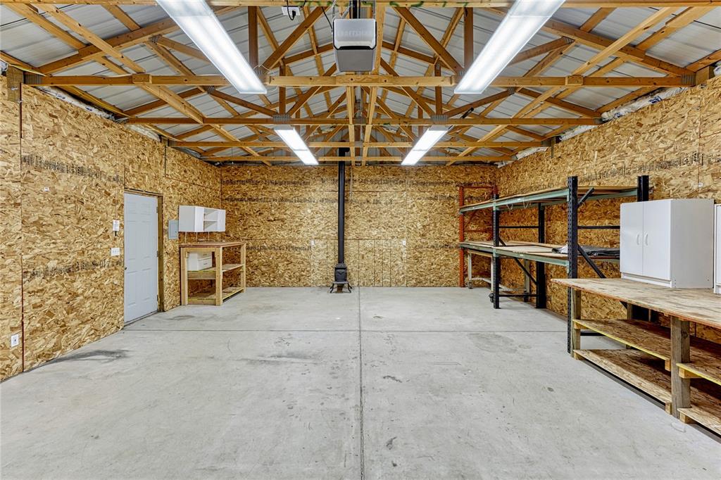 Image 40 of 49: Garage / workshop has heat and electric