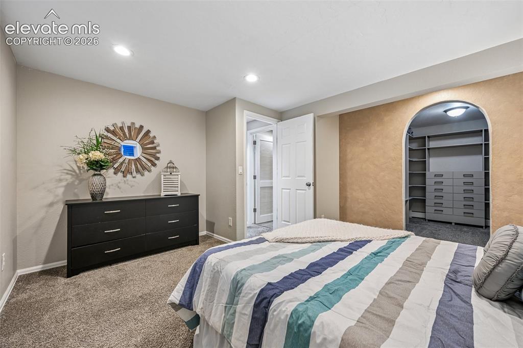 Image 17 of 41: Primary bedroom in basement