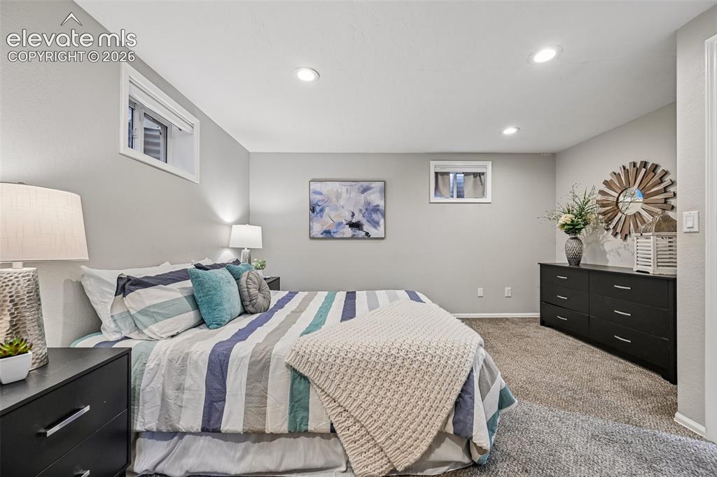 Image 18 of 41: Primary bedroom in basement