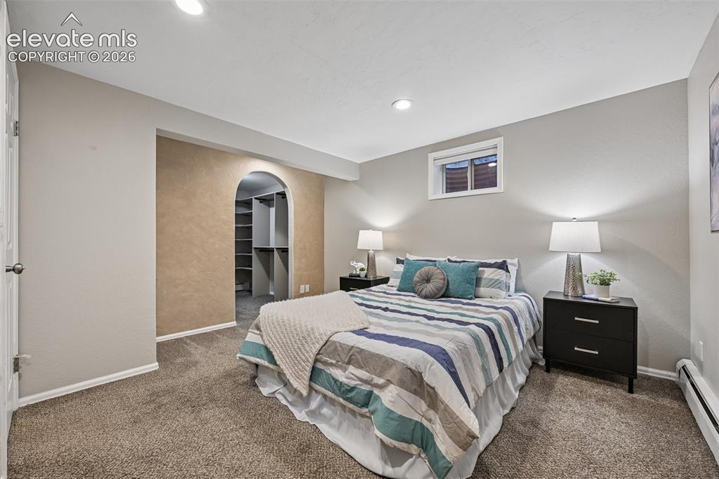 Image 19 of 41: Primary bedroom in basement