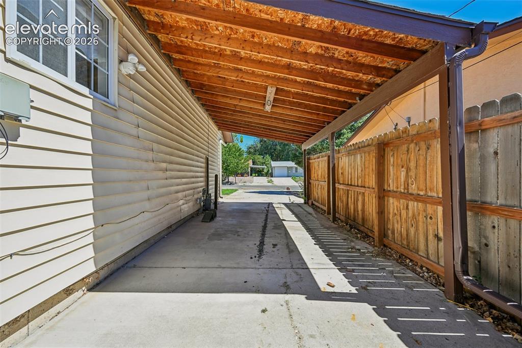 Image 7 of 41: Carport from backyard