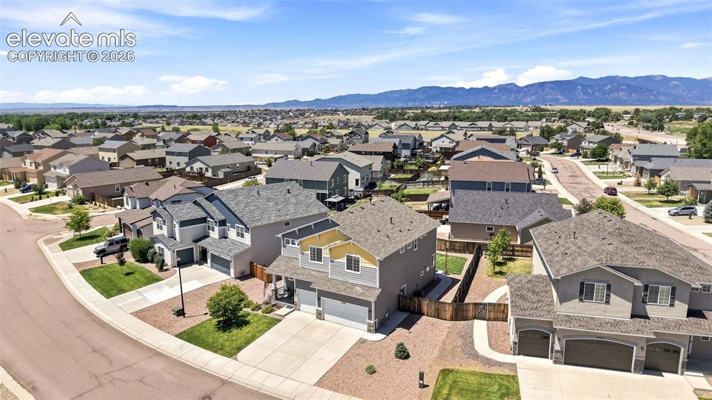 Image 45 of 50: Residential neighborhood featuring multiple single-family homes with mounta