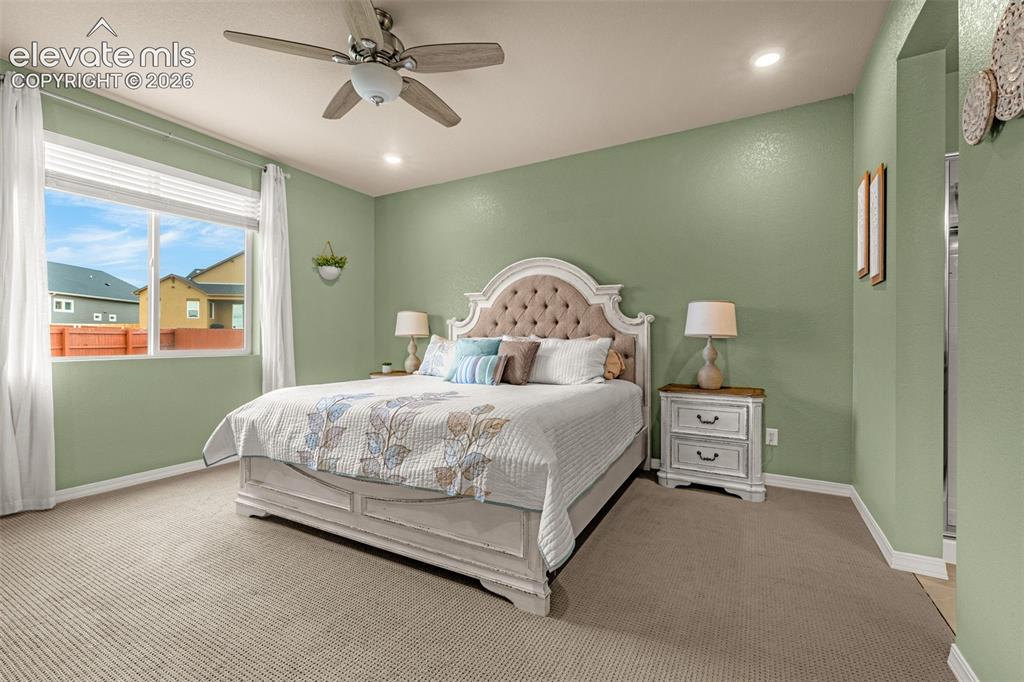 Image 16 of 40: Wall-to-wall carpeting, recessed lighting, and a ceiling fan with integrate
